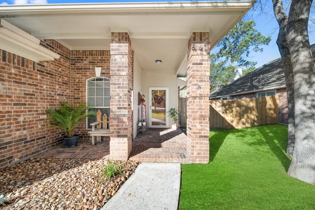 property entrance with a yard