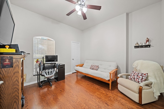 office with hardwood / wood-style flooring and ceiling fan