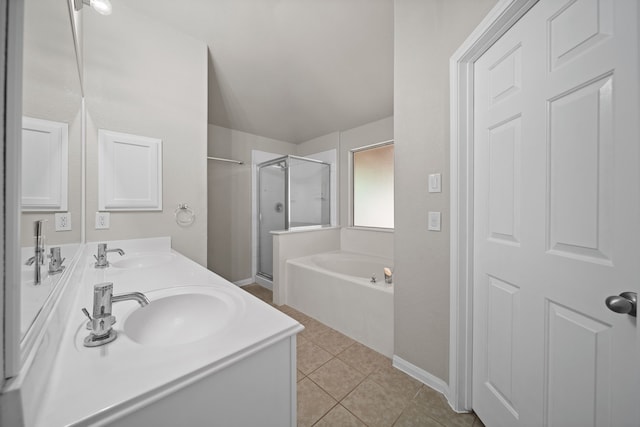 bathroom featuring tile patterned flooring, vanity, and plus walk in shower