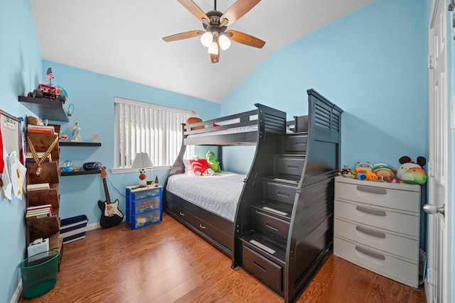 bedroom with ceiling fan, wood-type flooring, and vaulted ceiling