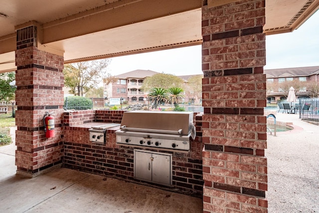 view of patio / terrace featuring an outdoor kitchen and area for grilling