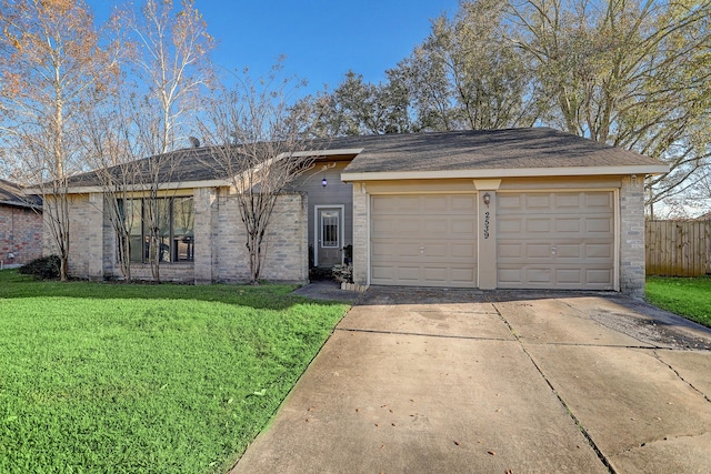 ranch-style house with a front yard and a garage