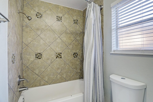 bathroom with toilet and shower / bathtub combination with curtain