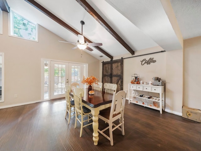 dining space featuring a barn door, ceiling fan, beamed ceiling, and dark wood-type flooring