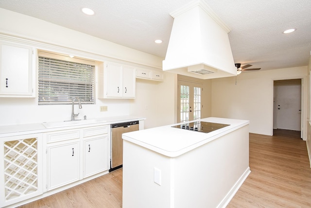 kitchen with black electric stovetop, stainless steel dishwasher, a kitchen island, sink, and white cabinetry