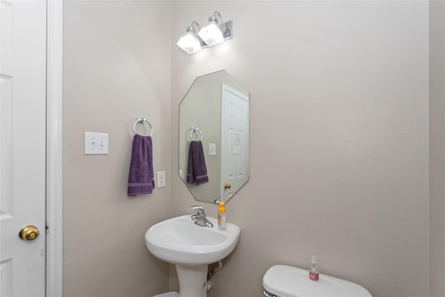 bathroom with toilet and sink