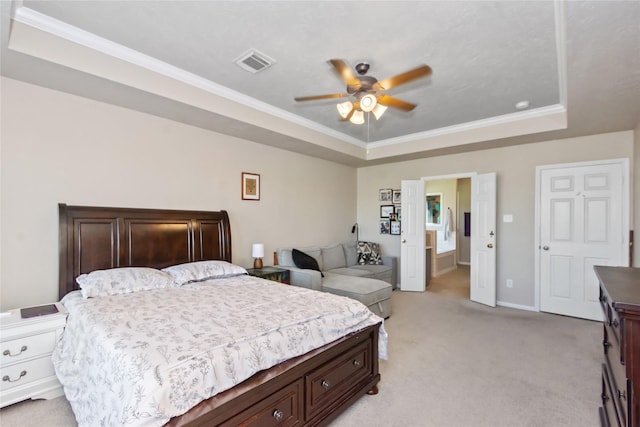 bedroom with light colored carpet, ceiling fan, a raised ceiling, and ornamental molding