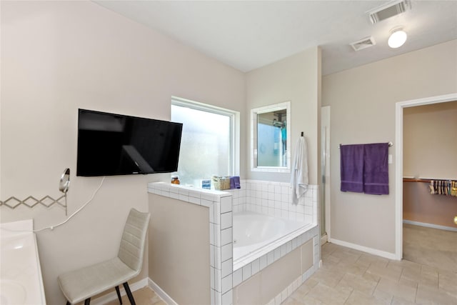 bathroom with shower with separate bathtub