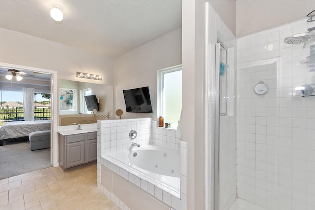 bathroom with shower with separate bathtub, vanity, and ceiling fan