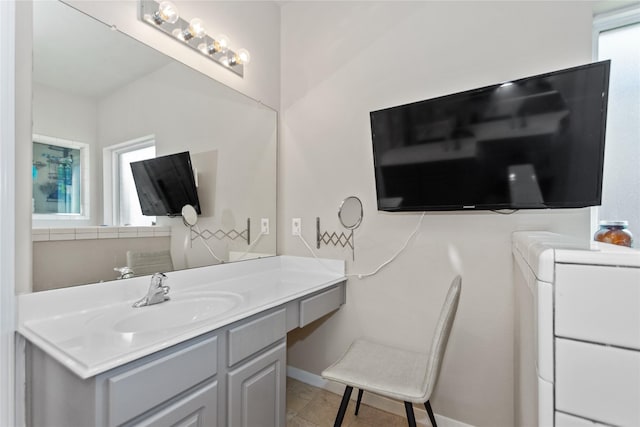 bathroom featuring tile patterned flooring and vanity