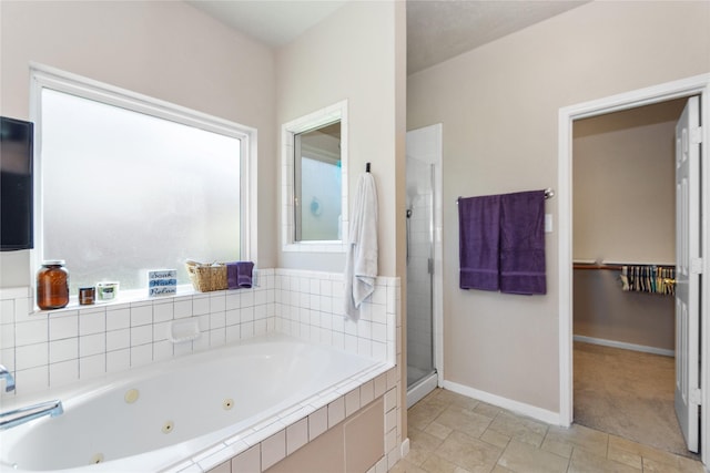 bathroom with separate shower and tub