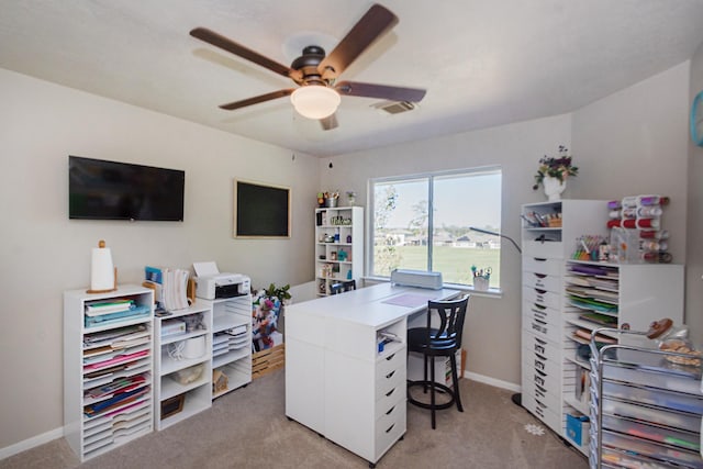 home office with light colored carpet and ceiling fan