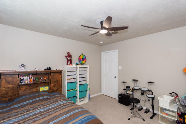 bedroom with light carpet, a textured ceiling, and ceiling fan