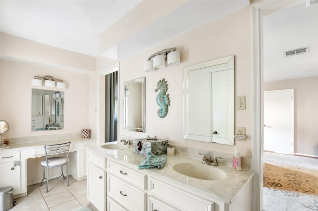 bathroom featuring tile patterned flooring and vanity