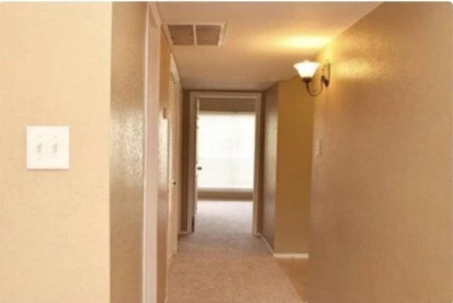 corridor with light carpet