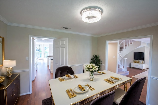 112 Kirkwood Ln, Conroe, TX 77304 - dining space featuring ornamental molding and dark wood-type flooring