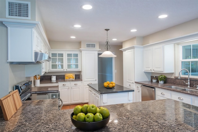 kitchen with dishwasher, electric range, white cabinetry, and sink