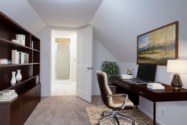 office featuring light colored carpet and vaulted ceiling