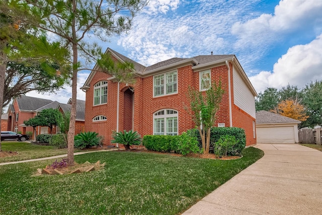 view of front of house featuring a front lawn and a garage