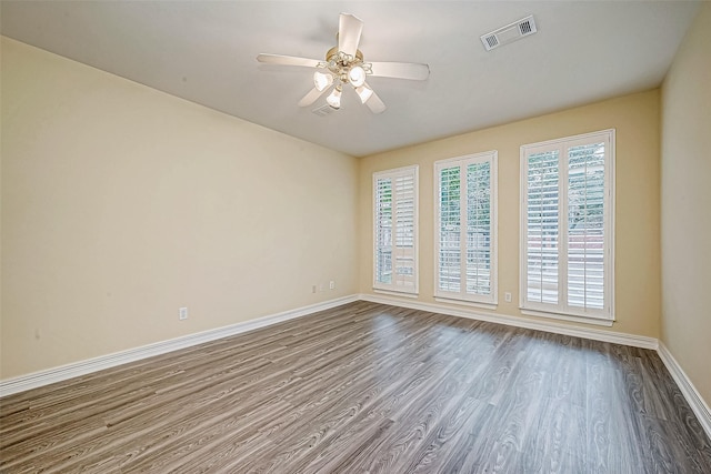 unfurnished room featuring ceiling fan and hardwood / wood-style floors