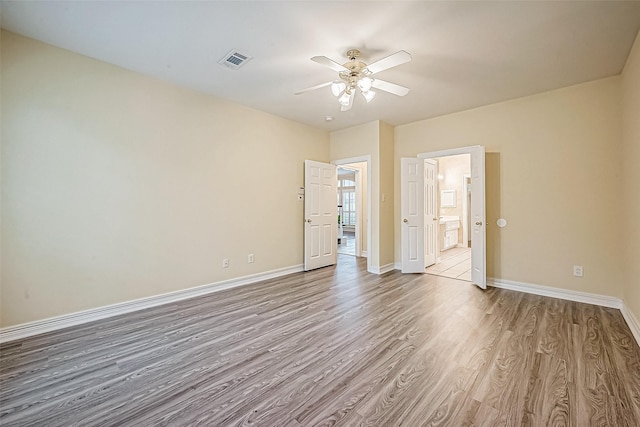 unfurnished bedroom with light hardwood / wood-style floors and ceiling fan