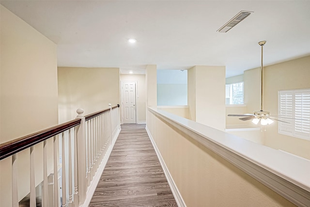 corridor with dark hardwood / wood-style floors