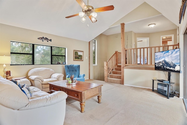 carpeted living room featuring ceiling fan and lofted ceiling