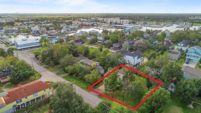 626 Clear Lake Rd, Clear Lake Shores, TX 77565 - aerial view of residential area with property boundaries highlighted and a nearby body of water