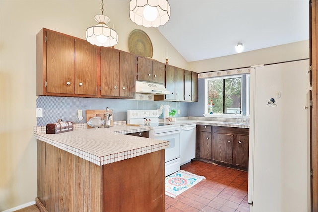 kitchen featuring tile patterned floors, kitchen peninsula, pendant lighting, vaulted ceiling, and white appliances