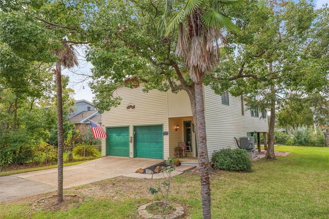 view of front facade featuring a front yard, a garage, and cooling unit