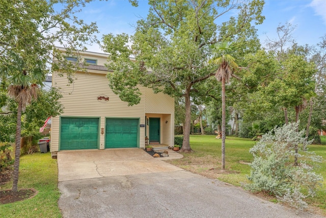 view of front facade with a front yard and a garage