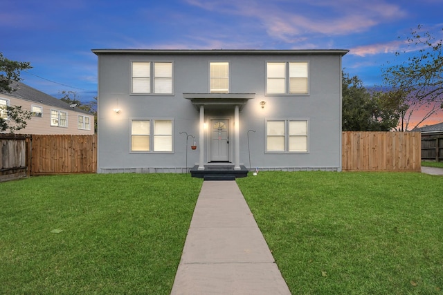 view of front of house with a lawn