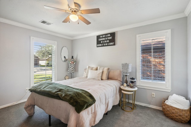 carpeted bedroom with ceiling fan and crown molding