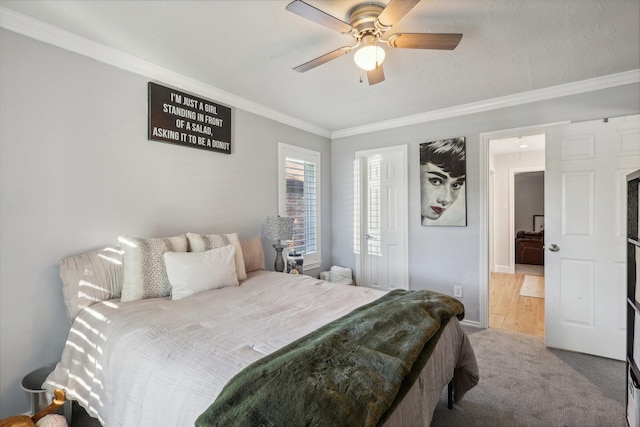 bedroom with wood-type flooring, ceiling fan, and ornamental molding