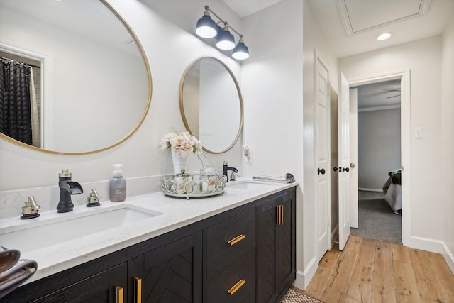 bathroom featuring hardwood / wood-style floors and vanity