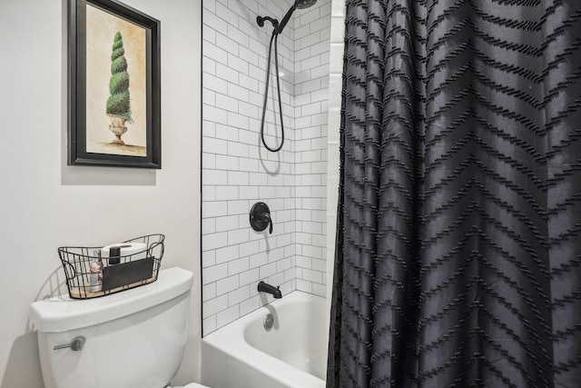 bathroom with shower / tub combo with curtain and toilet