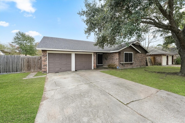 ranch-style home with a garage and a front lawn