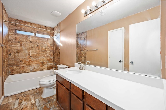 full bathroom featuring vanity, toilet, and tiled shower / bath