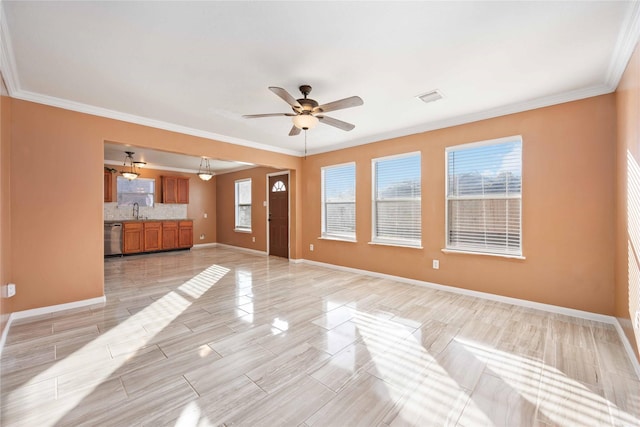 unfurnished living room featuring light hardwood / wood-style flooring, ceiling fan, crown molding, and sink