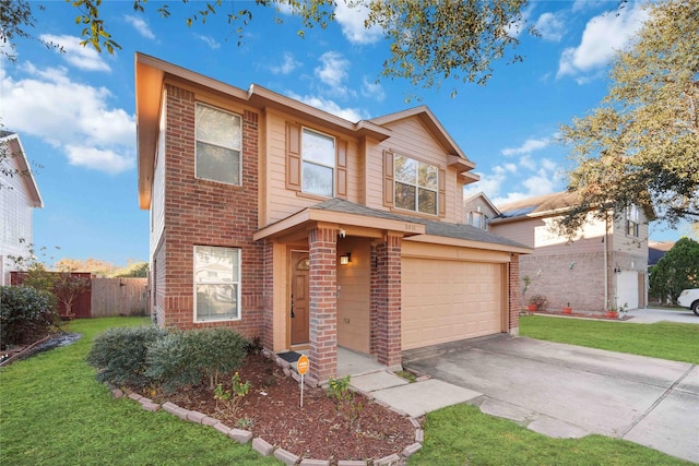 view of front of property featuring a garage and a front lawn