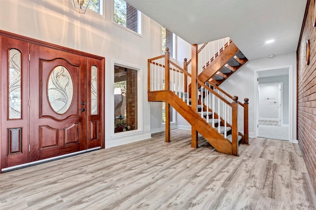 entrance foyer with light hardwood / wood-style flooring