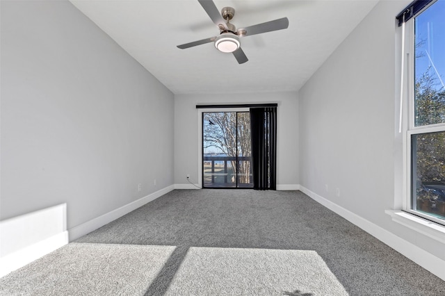 unfurnished room with carpet and ceiling fan