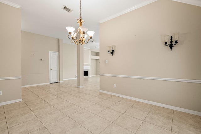 empty room with ornamental molding, light tile patterned floors, and a notable chandelier