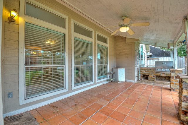 view of patio featuring an outdoor kitchen, ceiling fan, and a grill