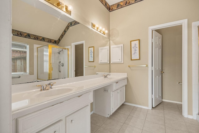 bathroom featuring tile patterned flooring, vanity, vaulted ceiling, and walk in shower