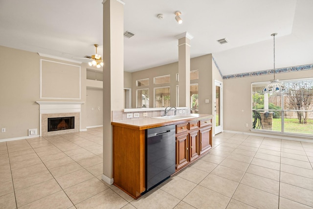 kitchen with pendant lighting, stainless steel dishwasher, a healthy amount of sunlight, and sink