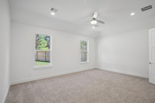 unfurnished room with ceiling fan and light colored carpet