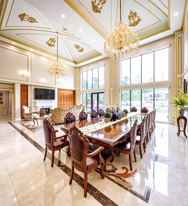 dining room with a healthy amount of sunlight, crown molding, and a high ceiling