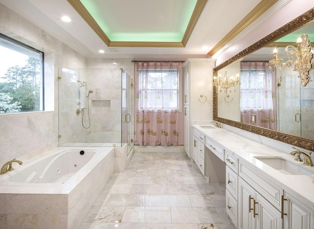 bathroom with a tray ceiling, plus walk in shower, vanity, and a notable chandelier