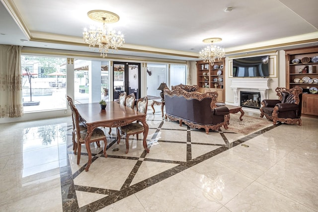 interior space with a raised ceiling and a chandelier